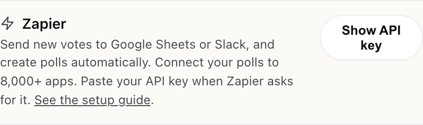 The Zapier row in Settings with a Show API key button